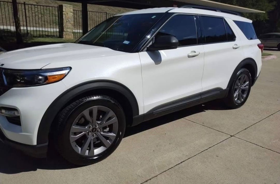 Finished white Ford Explorer exterior from the front side