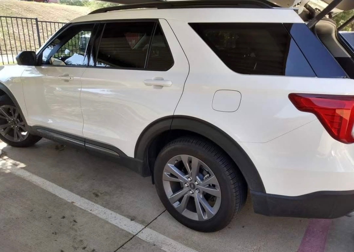 Finished white Ford Explorer exterior from the rear side
